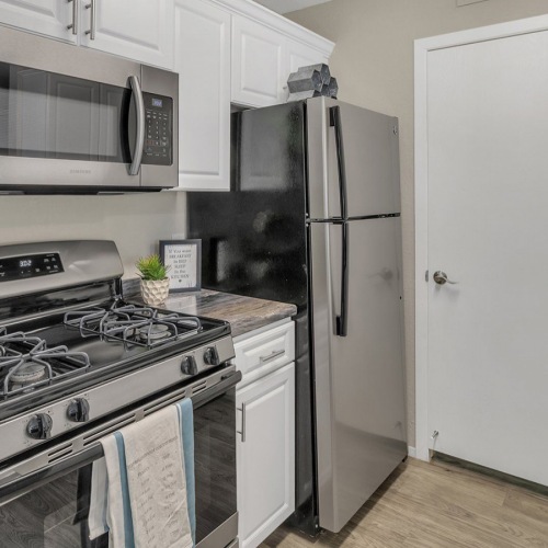 well lit c-shaped kitchen